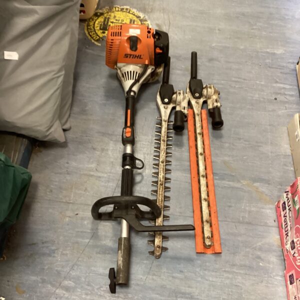 Stihl KM90R hedge cutter attachment for garden landscaping.