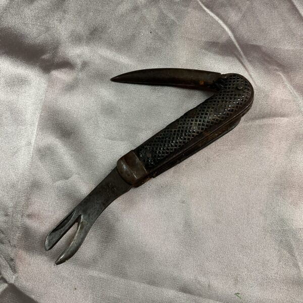 Open WWII military jack knife showing hook blade.