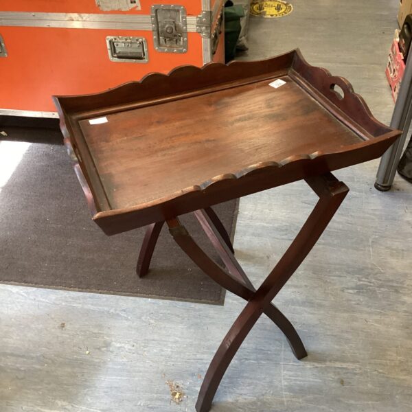 Vintage mahogany butlers tray with folding stand, side view.