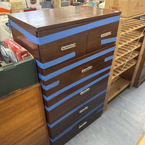 Dark wood vintage tallboy chest of drawers with six drawers.