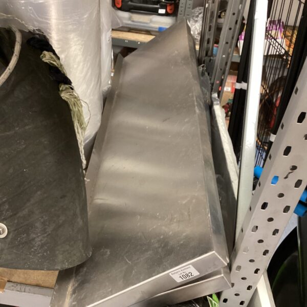 Stainless steel shelf with brackets for durable storage.