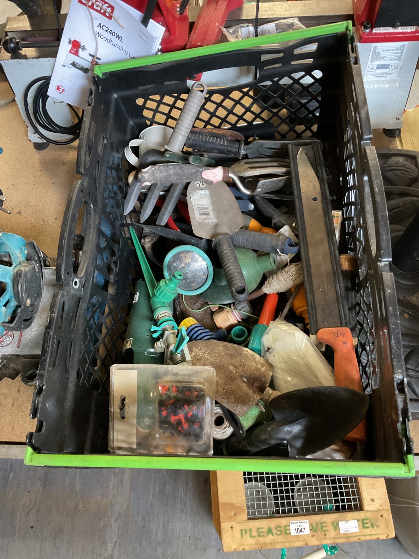 1059 Box of gardening tools including multiple trowels, hand forks and secateurs