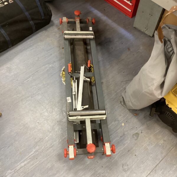 Metal mitre roller table in a workshop setting.