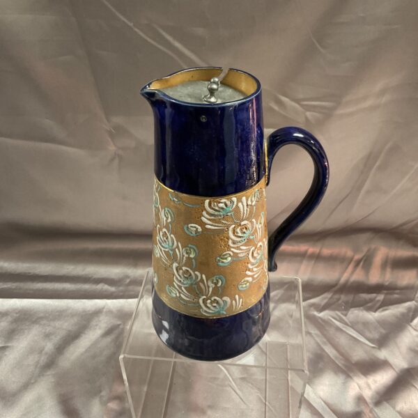 Antique Royal Doulton Slater Tapestry Pitcher with floral design.