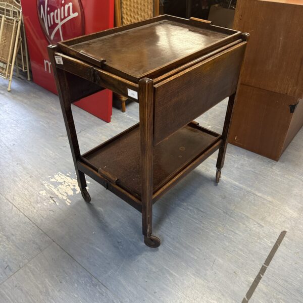 Vintage mahogany folding butler's trolley with folding sides.