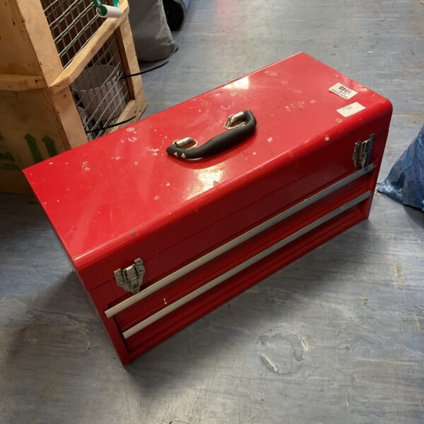 Vintage red mechanics toolbox for tool storage in a workshop.