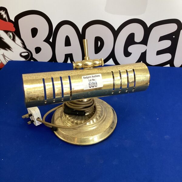 Vintage brass table lamp with adjustable neck and weighted base.