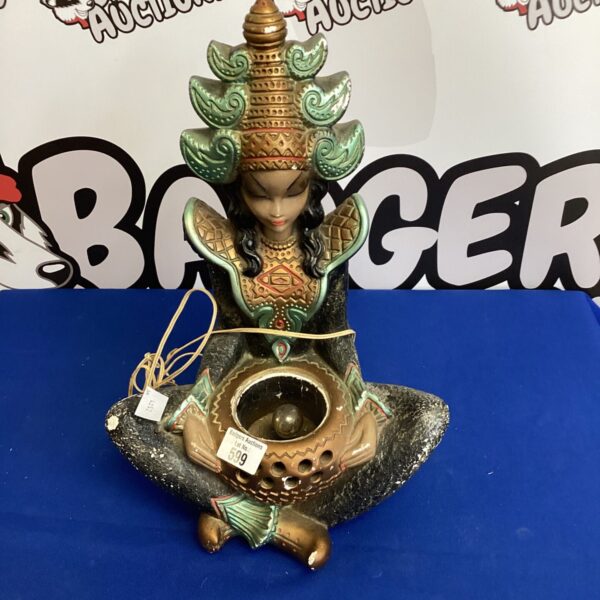 Vintage Indian ceramic table lamp with sculpted figure.