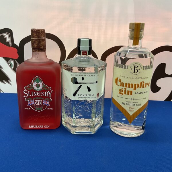 Three bottles of premium gin including Slingsby, Roku and Campfire.