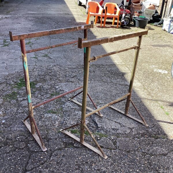 Pair of metal builders tressels for construction and DIY projects.
