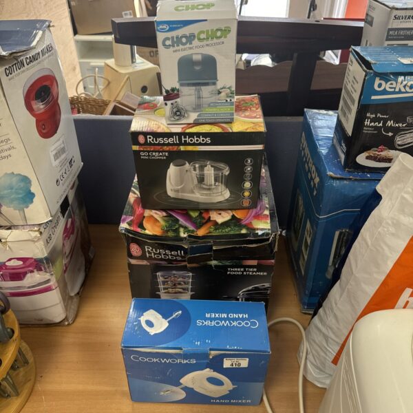 Kitchen food preparation items including a hand mixer and choppers.