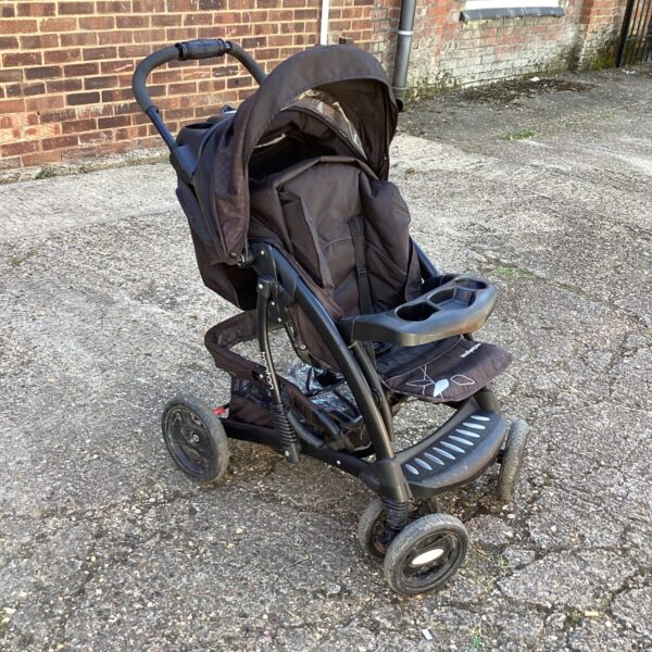 Front view of a vintage Mothercare baby walker.