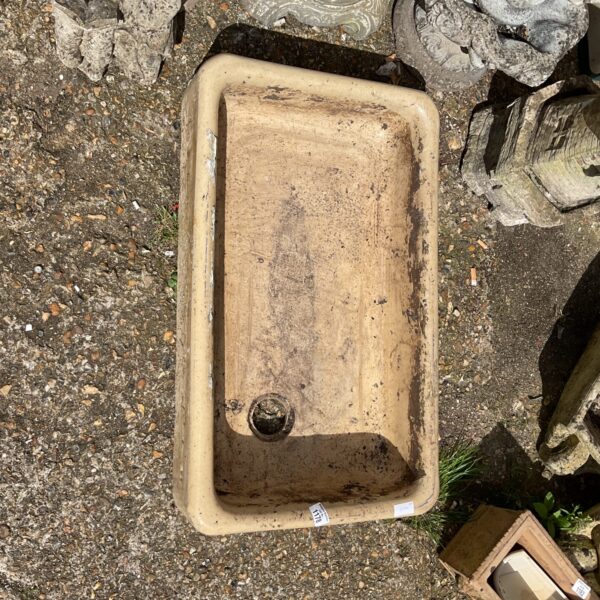 Vintage ceramic Belfast sink with a shallow basin.