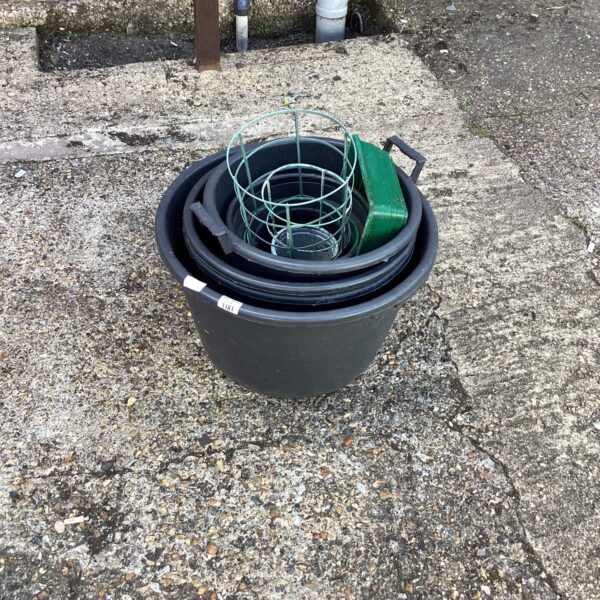 Selection of three plastic garden tubs for planting and storage.