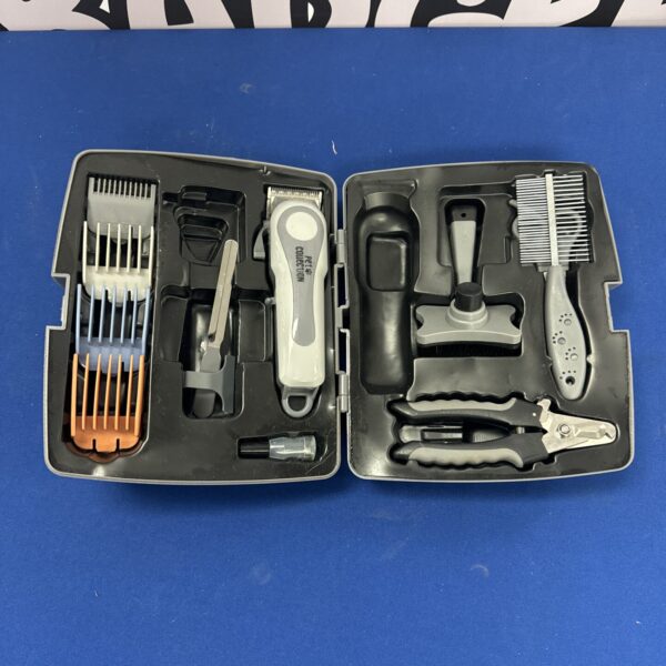 Vintage dog grooming set with clippers and scissors.