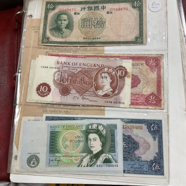 Chinese banknotes within a bank note album.