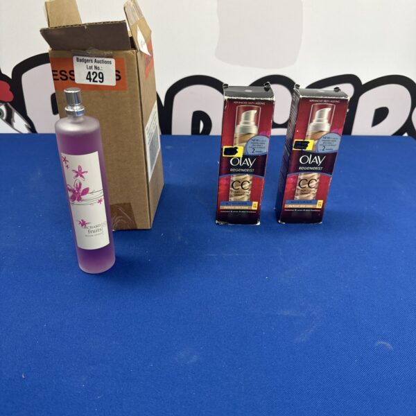 Tu Orchard Fruits room spray and Olay complexion corrector bottles in a lot.