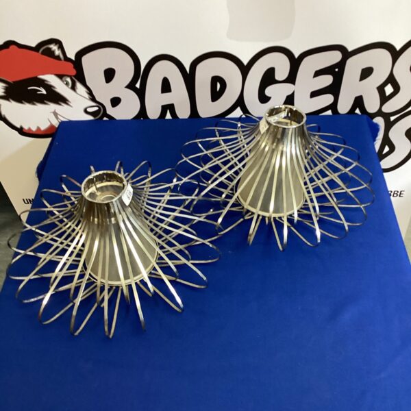 Pair of vintage atomic light shades with metal rod construction.