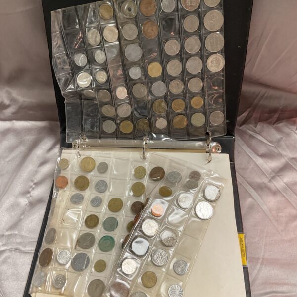 Full vintage coin album with various coins displayed.