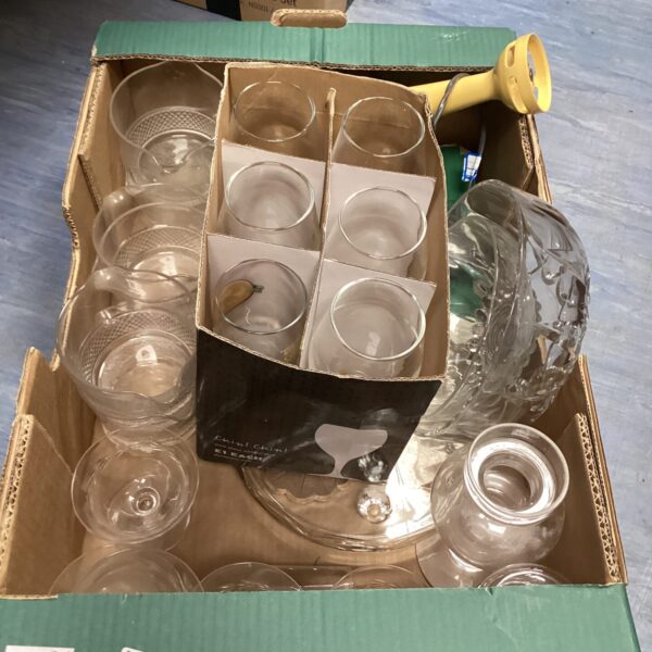 Assorted vintage wine glasses on a tray, clear glassware.