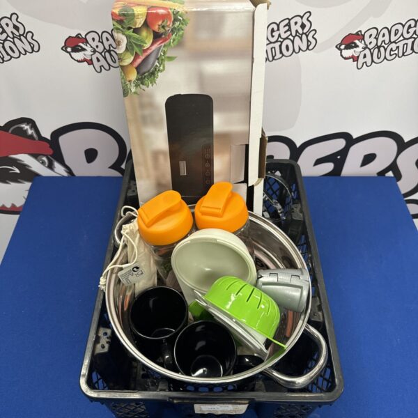 Kitchenware set with vacuum sealer and stainless steel bowls.