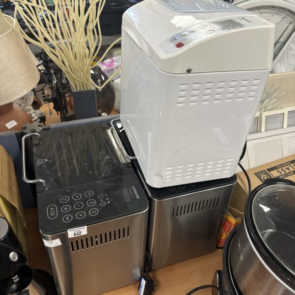 White Kenwood bread maker with digital display for home baking.