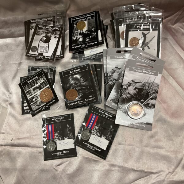 Collection of wartime commemorative coins depicting key WWII events.