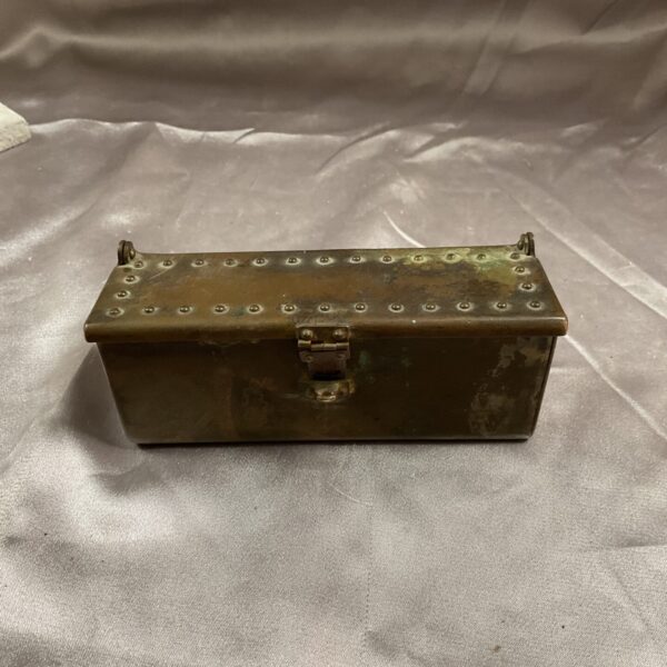 Small brass trench art box with hinged lid, a unique military souvenir.