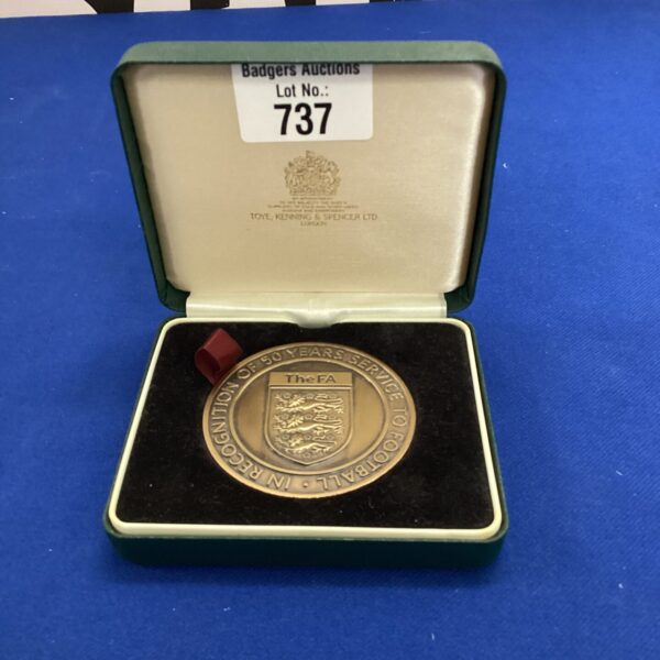 Close-up of the FA 50 Years of Service commemorative coin.