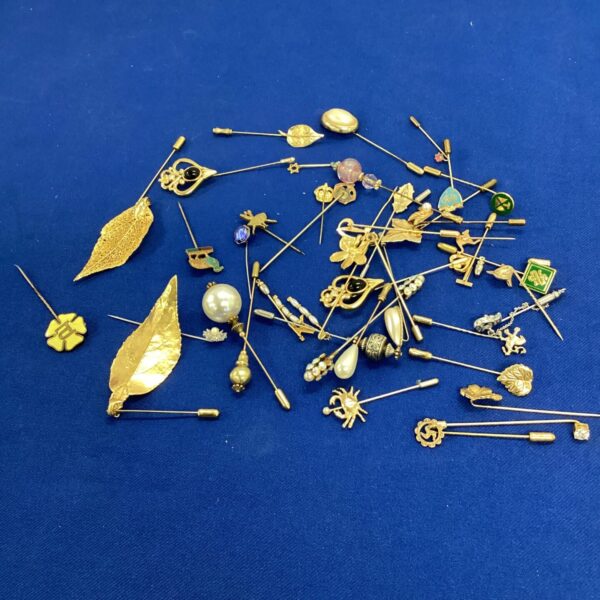 Vintage hat and tie pin collection, antique jewellery accessories.