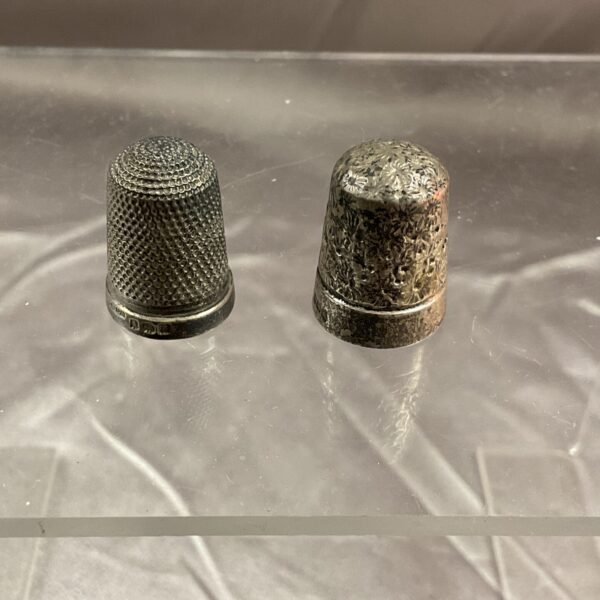 Antique silver thimbles, a hallmarked pair for collectors.