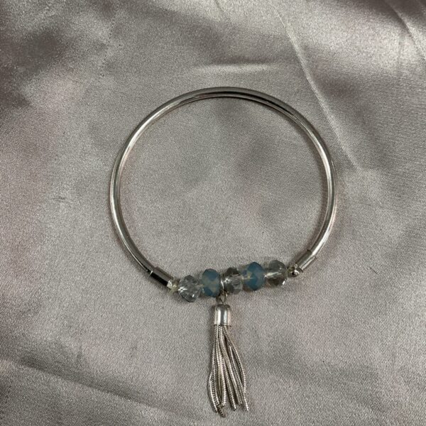 Silver bangle bracelet with iridescent Aurora Borealis glass bead.