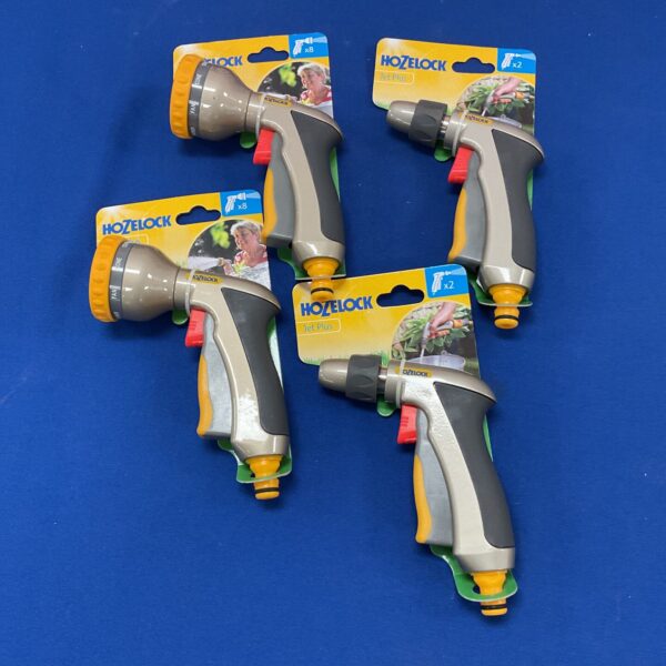 Four Hozelock hose nozzles in original packaging for garden watering.