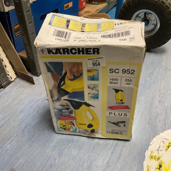 Kärcher SC952 handheld steam cleaner in box.
