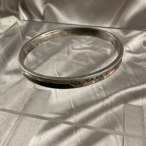 Vintage Tiffany & Co silver bracelet with concave design.
