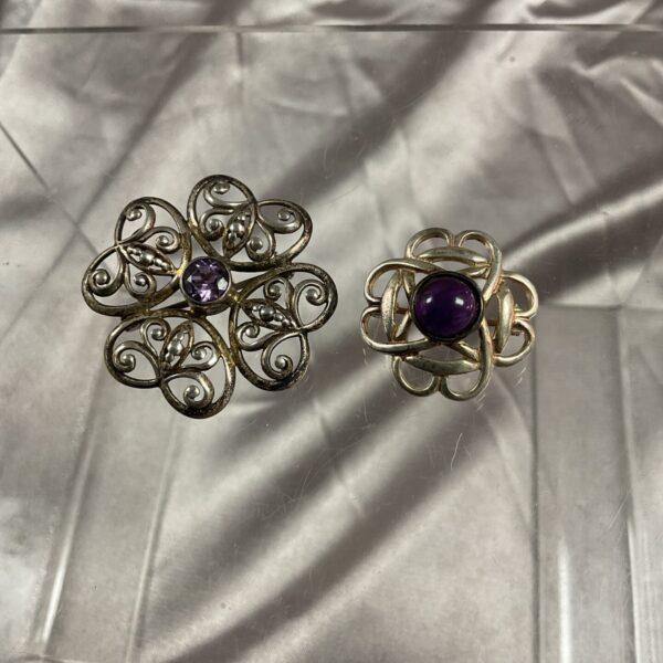 Vintage silver amethyst Celtic brooches with butterfly details.