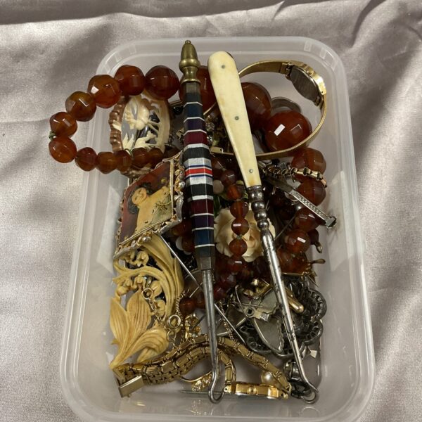 Vintage costume jewellery lot with beaded necklaces and stick pins.