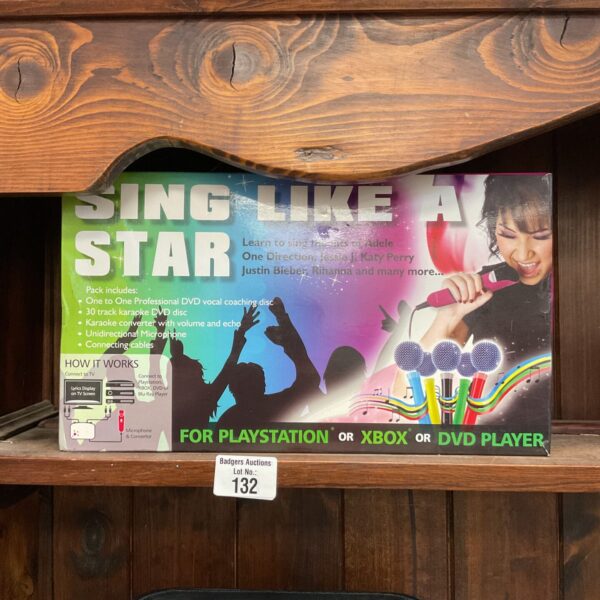Singstar karaoke set with microphone and DVD for Playstation, Xbox, or DVD player.