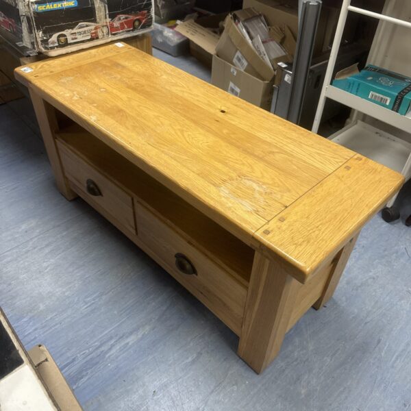 Vintage light oak TV stand cabinet with doors.