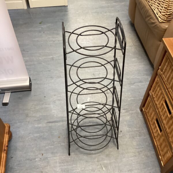 Five tier metal pot plant stand for displaying plants.