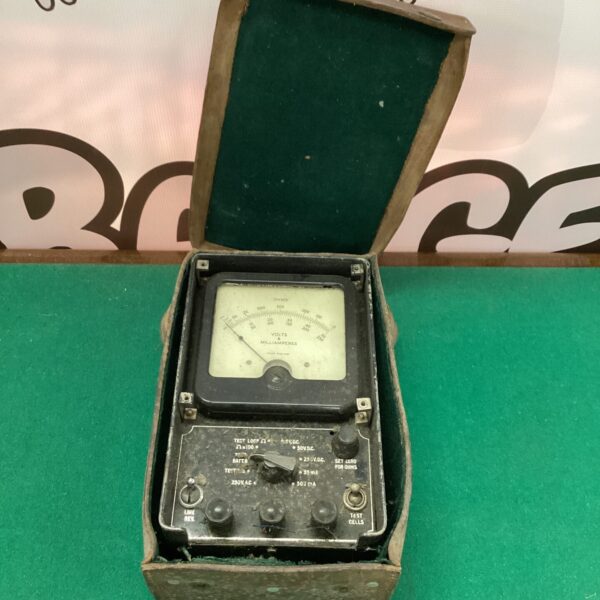 Vintage analog multimeter with clear scale for electrical testing.
