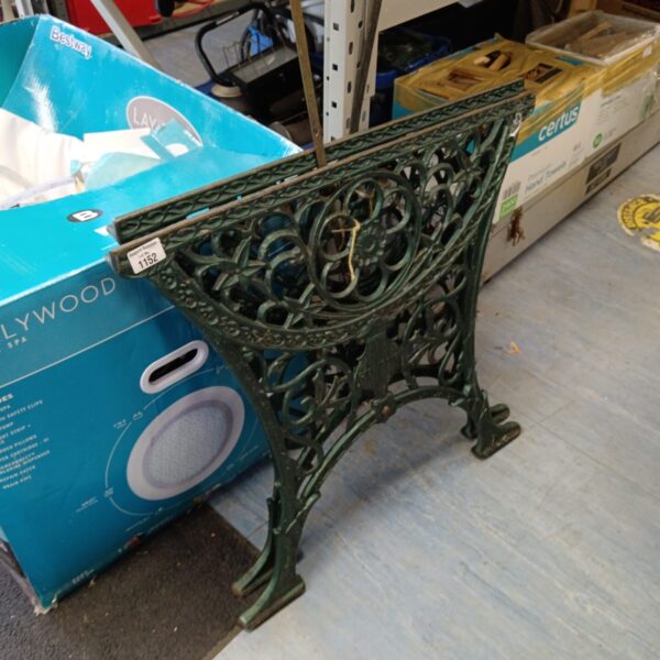 Ornate cast iron table ends for garden furniture restoration.