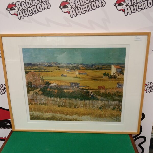 Framed Van Gogh harvest print depicting a golden landscape scene.