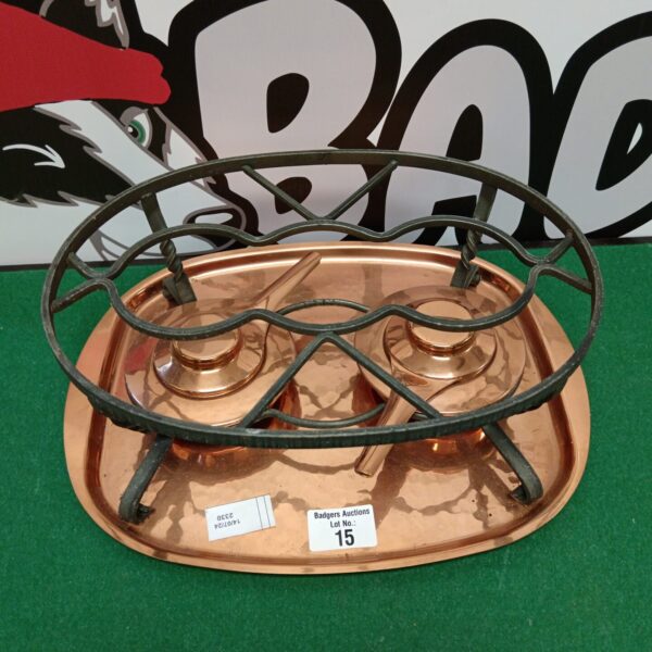 Vintage Swiss copper pan warmer with iron legs.