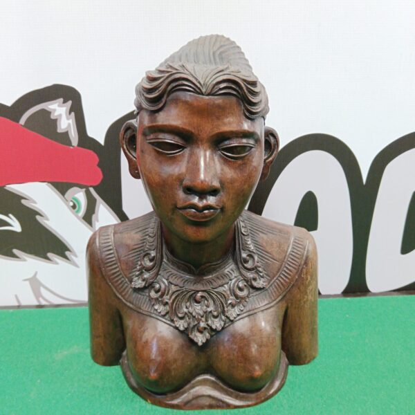 Vintage Klungkung carved wooden bust of a tribal girl.