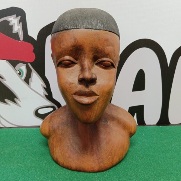 Hand-carved wooden bust of an African boy, tribal art sculpture.