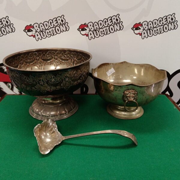 Ornate silver on copper bowls, including a Viner’s bowl, for serving.
