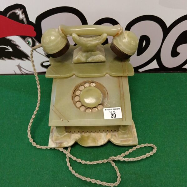 Vintage green onyx rotary telephone, a collectible desk phone.