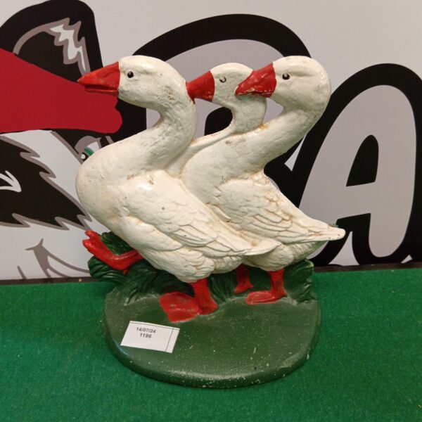 Vintage cast iron goose doorstop for farmhouse decor.