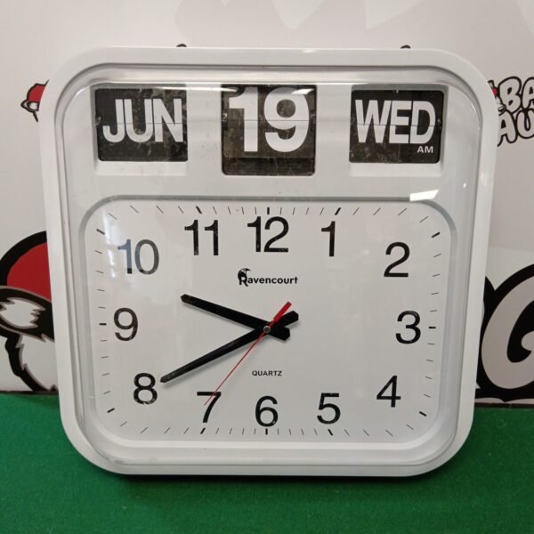 Front view of vintage Ravencourt day date wall clock.